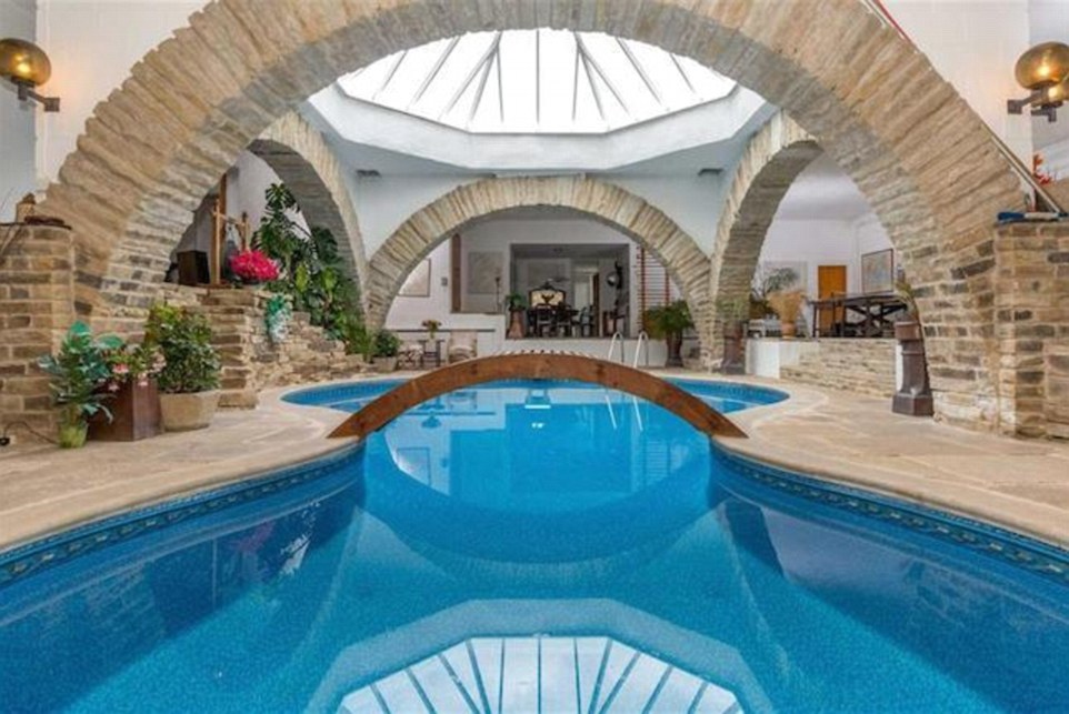 On the market: A sprawling underground home built into the earth by a famous architect has gone on sale for £700,000