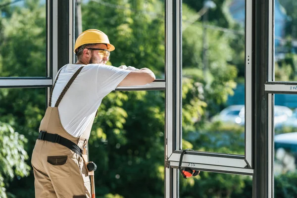 Construction Worker Protective Helmet Googles Resting Looking Windows — стоковое фото